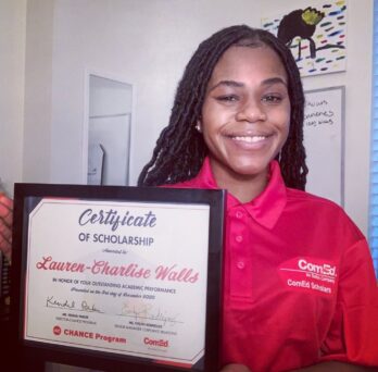 CHANCE student Lauren-Charlise Walls holding the Certificate of Scholarship for the ComEd Scholarship. 